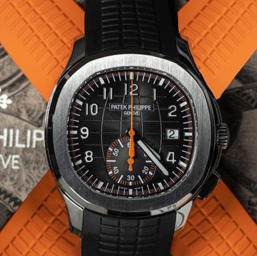 Patek Philippe Aquanaut 5968A Stainless Steel Black Dial with Organic accents shown above orange straps. Collection Photo.